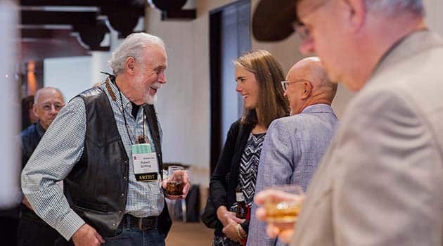 Eiteljorg artists and patrons talking at gallery exhibit